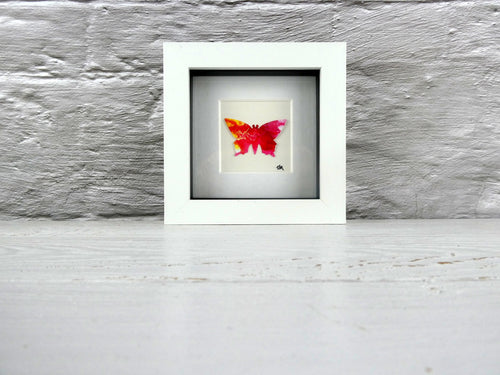 One framed butterfly (red)